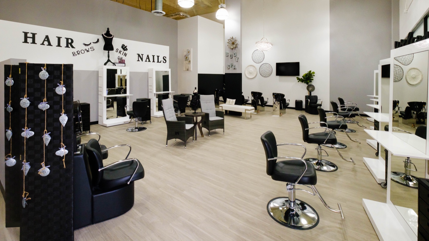 Open salon floor with styling chairs and service areas