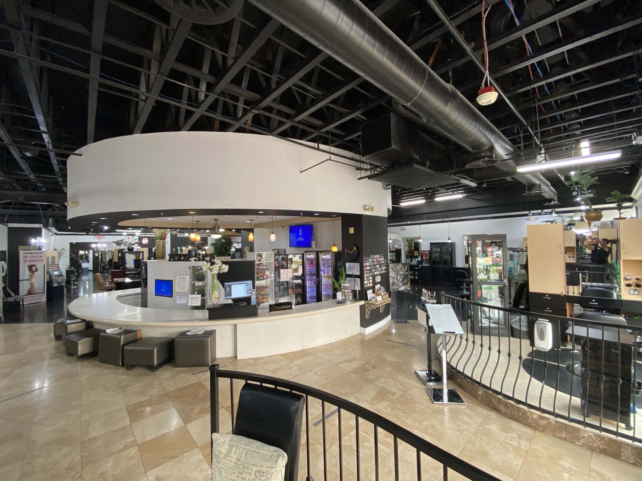 Body Spa West interior with reception, open salon floor, and work areas